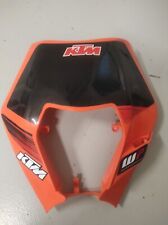 MASCHERINA PORTA FARO ARANCIONE KTM EXC 125/200/250/300 08-13