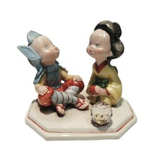 Statua porcellana samurai e geisha