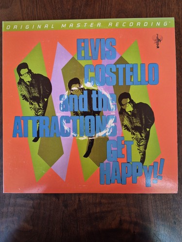 Elvis costello get - -,