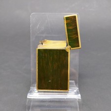 Accendino Dupont con decorazione che riproduce il legno, bordi dorati con graffi