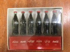 Bottiglie contorno Coca-Cola