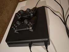 PS4 SLIM 1 TB  + 2 DUAL SHOCK
