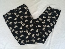 Pantaloni neri con fantasia a
