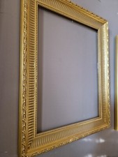 cornice in legno laccata oro