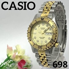 Orologio da polso uomo vintage CASIO MD-702 analogico oro day-date quarzo usato senza scatola