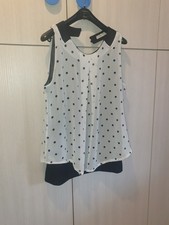 blusa a pois smanicata bianco nera