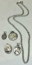 Lotto 4 ciondoli santo argento