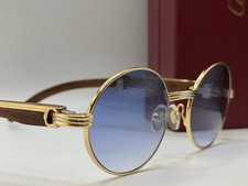Occhiali da sole Cartier oro e