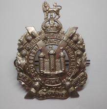 cap badge of the KINGS OWN SCOTTISH BORDERERS with lugs to reverse