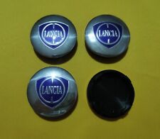 4 TAPPI Coprimozzo COMPATIBILI LANCIA Y Ypsilon Delta Musa Cerchi in Lega 56 mm