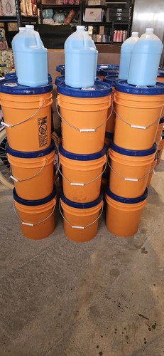 Orange plastic water barrel - plastic,