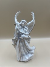 Angelo natalizio con strumento