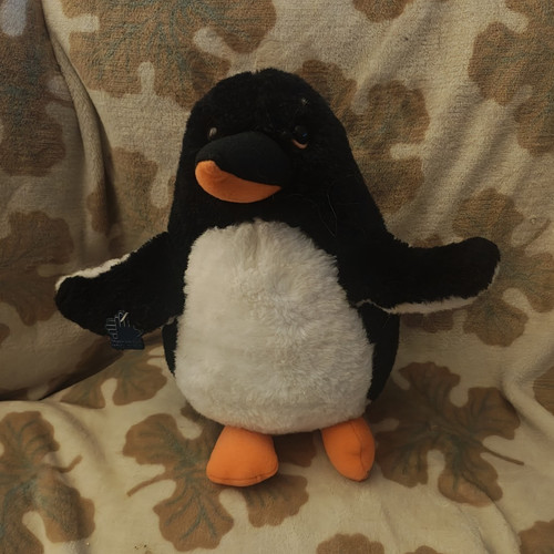 Peluche pinguino applausi