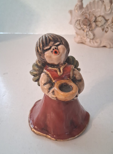 Statuina angelo cantante
