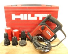 Trapano a percussione rotativo