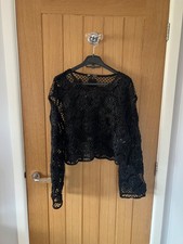 Top all'uncinetto nero manica