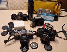 Reflex Canon A-1 + Canon AT-1 + tele 300 mm + obiettivi: 135 mm,  28 mm, macro+