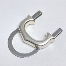 Fermasoldi Cartier motivo C de