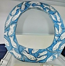 Cornice con specchio ovale