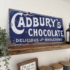 Insegna cadbury in metallo
