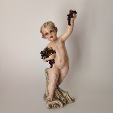 Figura di putto con uva -