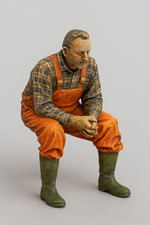 Statua pescatore seduto per