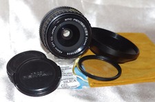 RARE objectif 24mm f2,8 PENTAX SMC, bouchons, filtre, pare-soleil et housse TBE