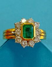 Anello  e orecchini d’oro con smeraldi e diamanti 