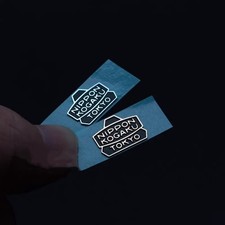 Adesivo logo metallo