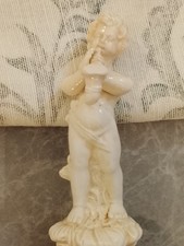 Putto musicista in porcellana
