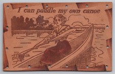 Canoeing Woman On Lake With