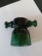 ANTICO E RARO  ISOLATORE IN VETRO VERDE SCURO, MARCATO "MIVA BT 3 M ".