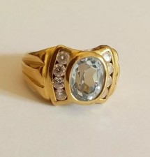 anello oro giallo 18ct donna topazio azzurro ovale 8 zirconia conica laterali