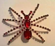 GRANDE SPILLA A FORMA DI RAGNO CON STRASS ROSSI