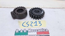 PAIR OF GEARS SET IN MOTION