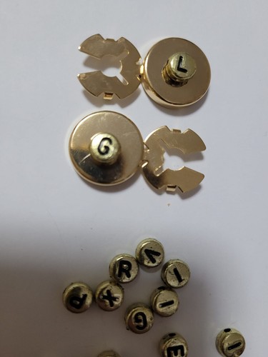Pezzo copribottoni col oro - pezzo,