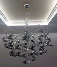 LAMPADARIO MODERNO CON RICCIOLI IN METALLO
